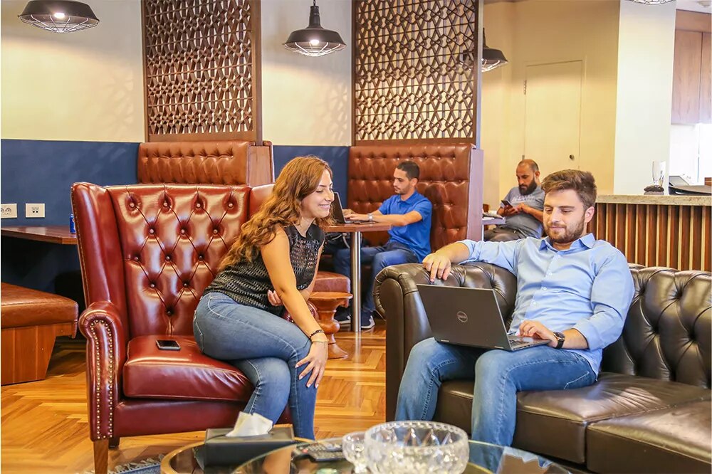Coworking Space at Beirut Souks with people networking, collaborating, or working at dedicated desks with a luxury fit out.