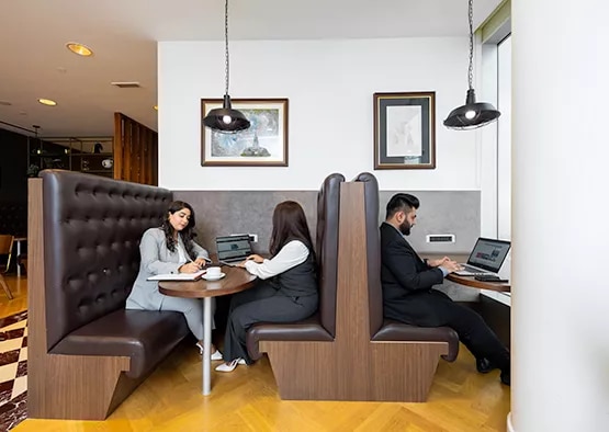 Clients are seen working and meeting in Servcorp’s stylish booth seating area, at Emirates Towers, Dubai